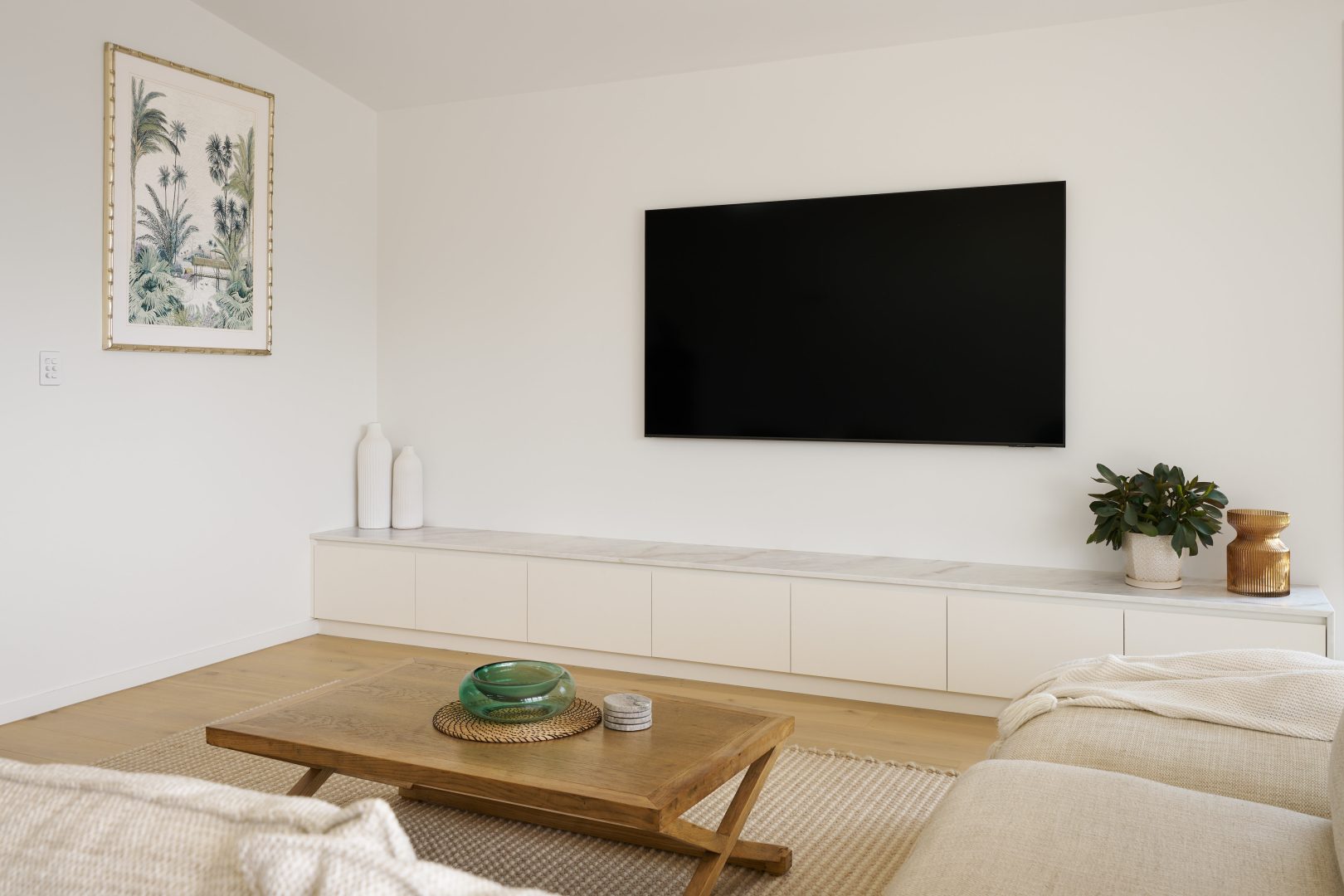 Minimalist living room with wall-mounted TV