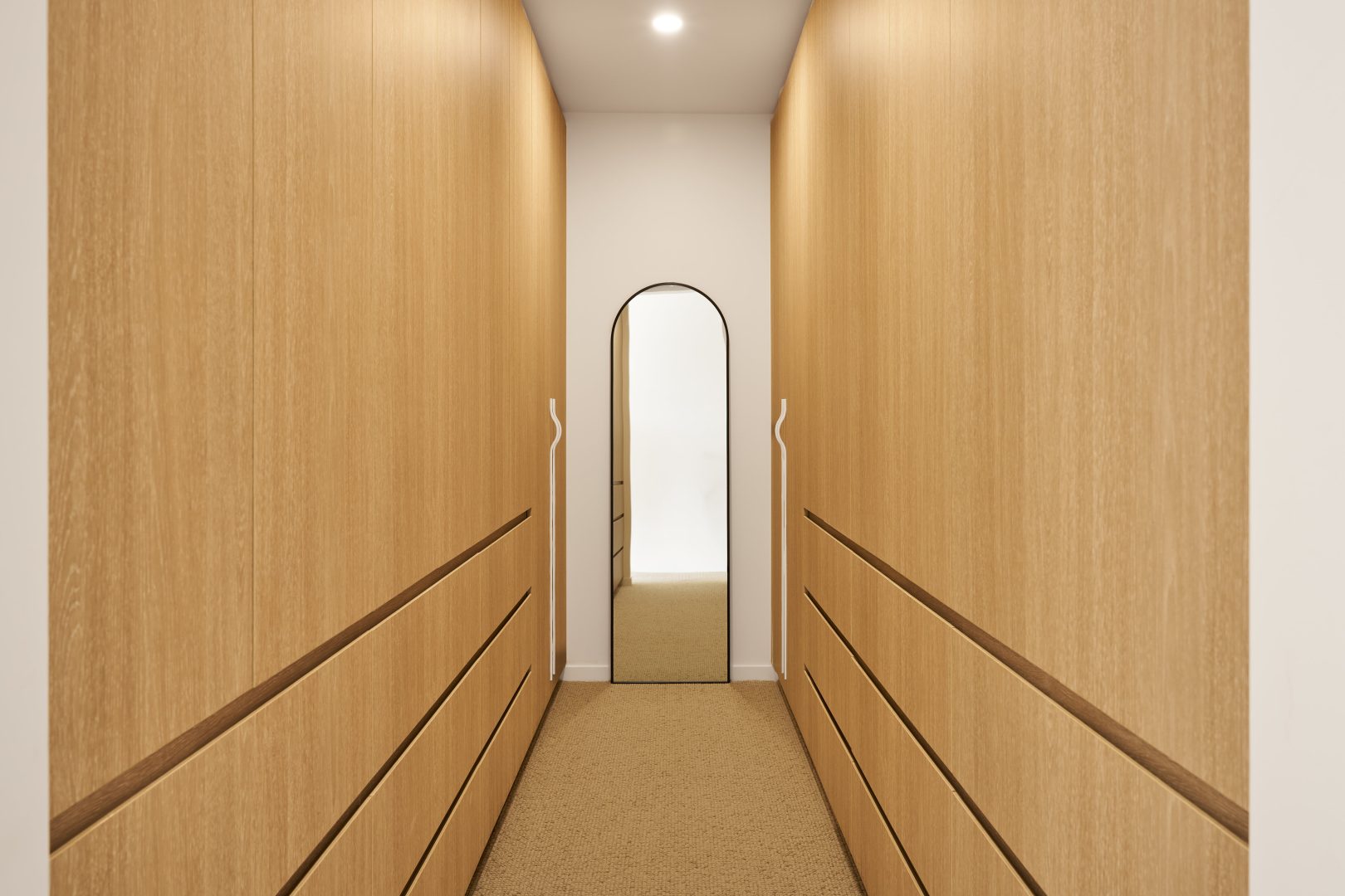 Modern wooden hallway with mirror and lights