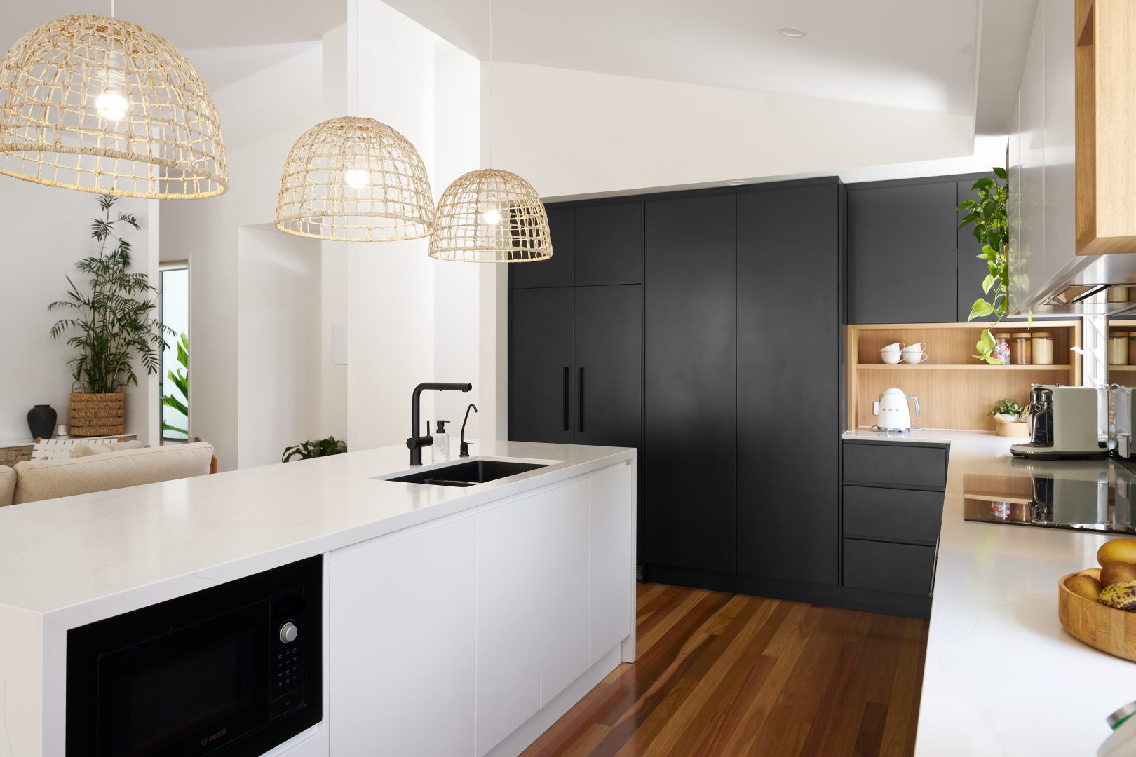 Modern kitchen with black cabinets and island