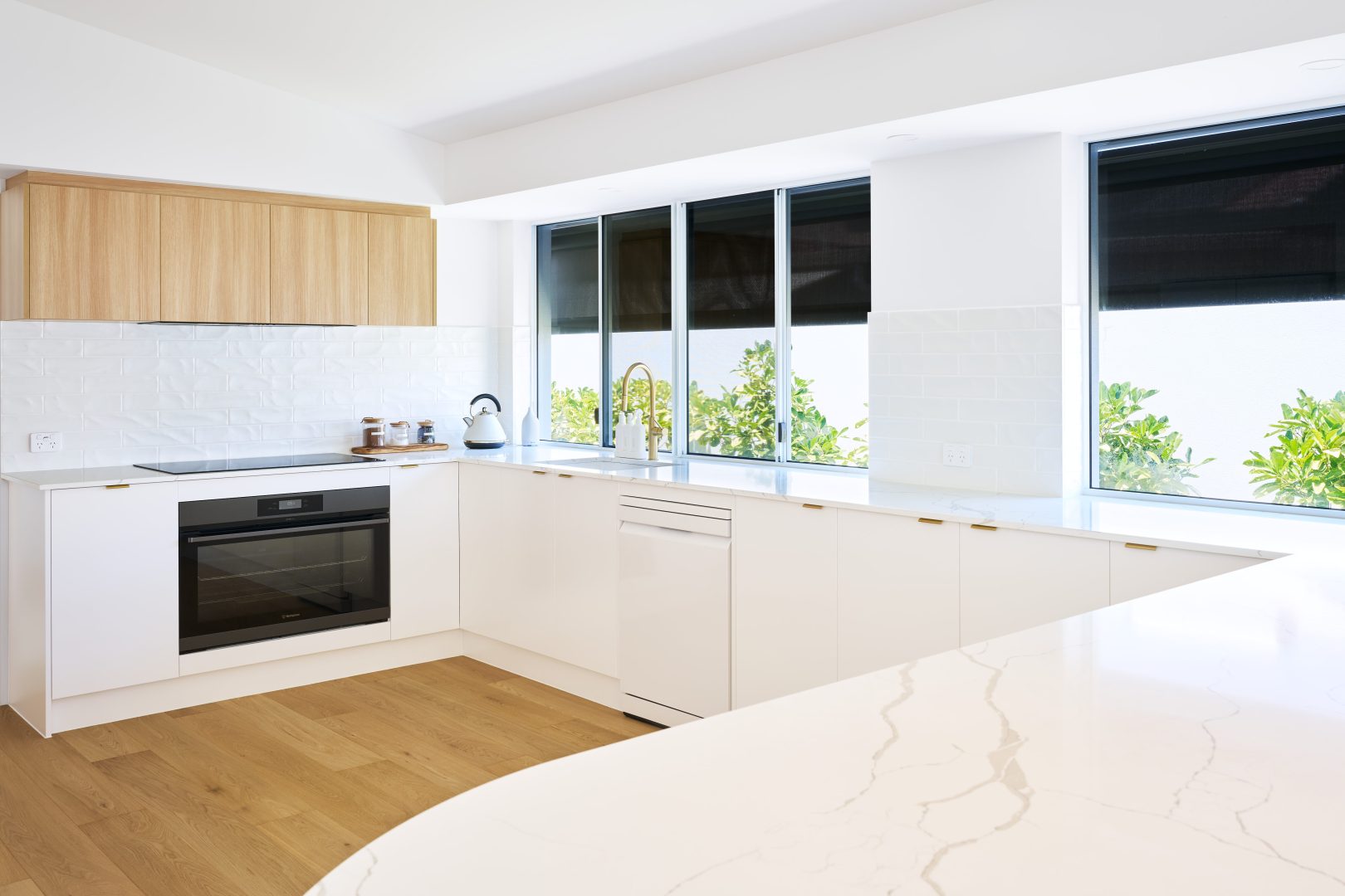 Modern kitchen with natural light and minimalist design.