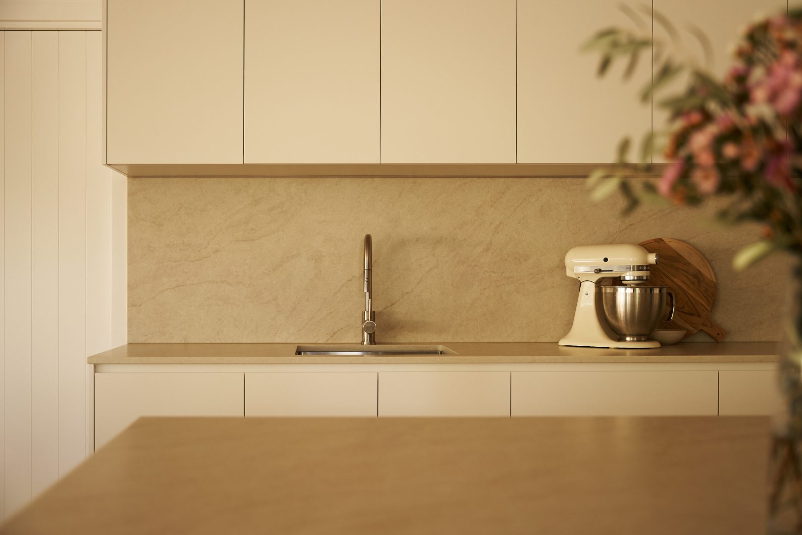 Modern kitchen with mixer and minimalist design.